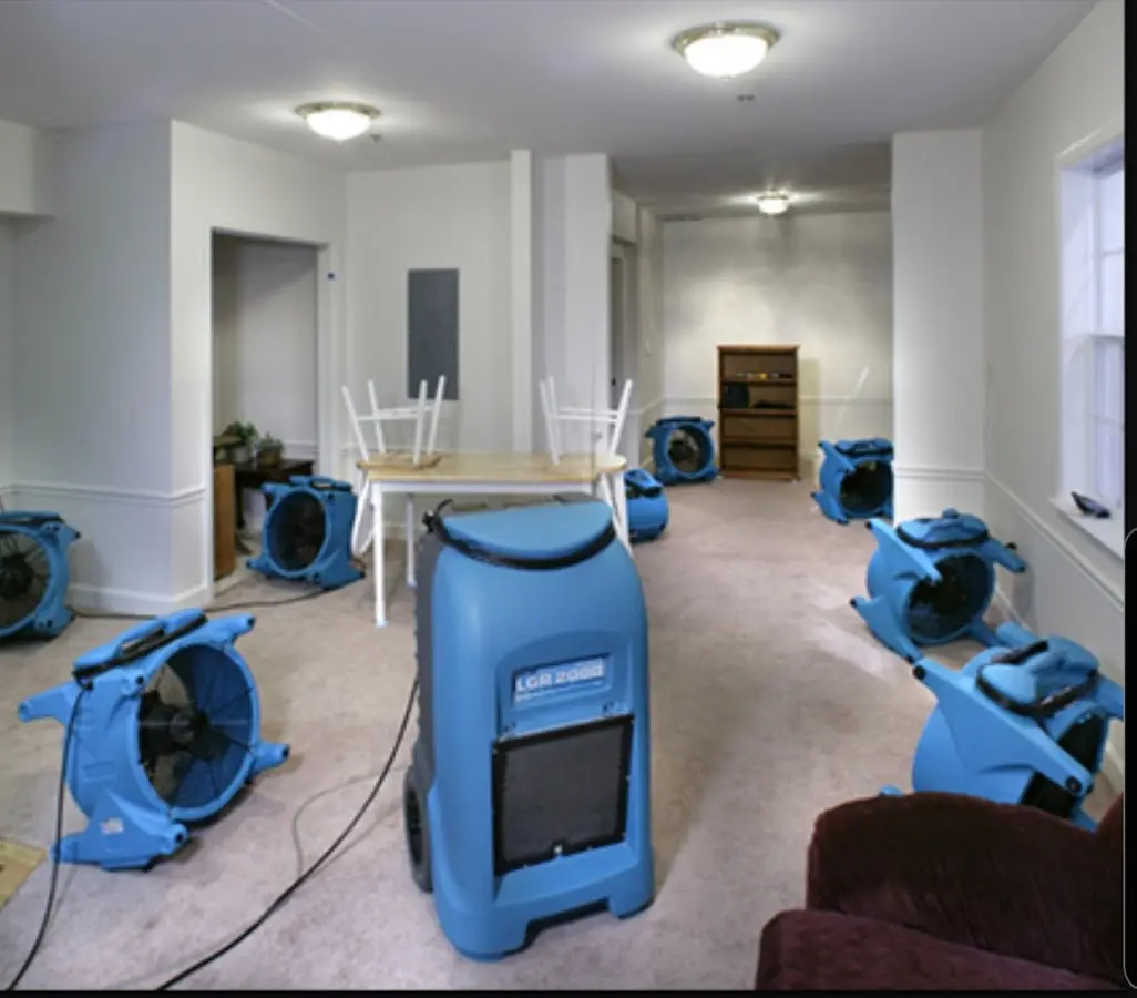 Air movers and dehumidifier setup for Water Damage Restoration in Four Square Mile
